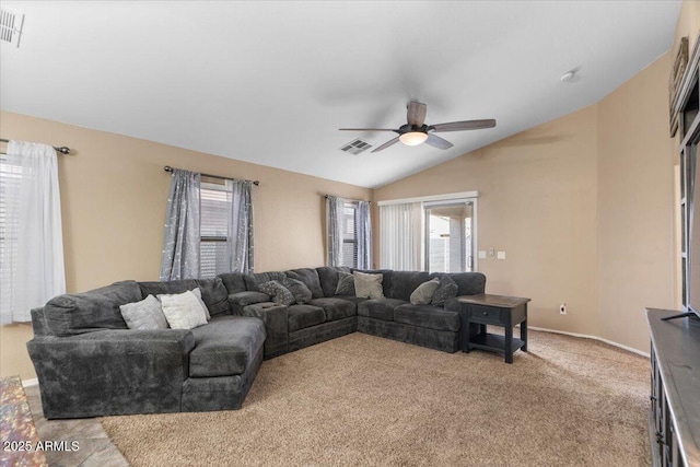 carpeted living room with ceiling fan and lofted ceiling