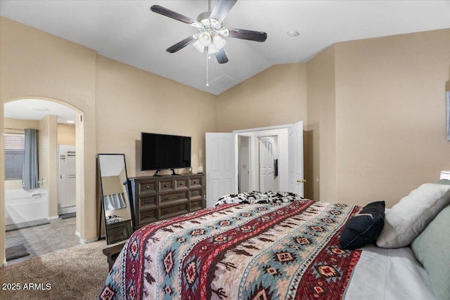 carpeted bedroom with vaulted ceiling and ceiling fan