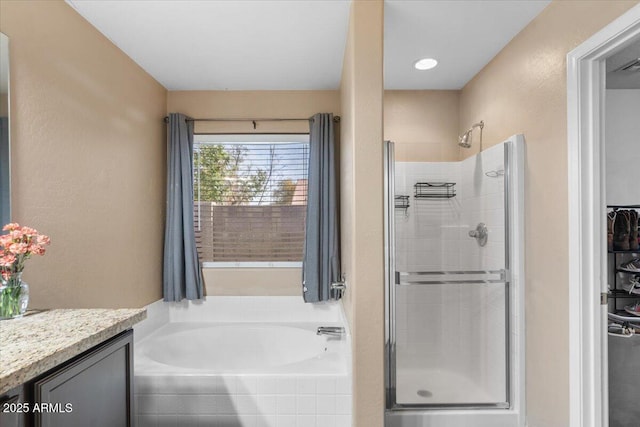 bathroom with separate shower and tub and vanity