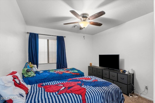 bedroom featuring ceiling fan and carpet floors