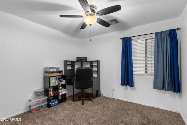 carpeted office featuring ceiling fan