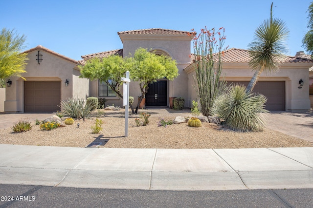 mediterranean / spanish-style house featuring a garage