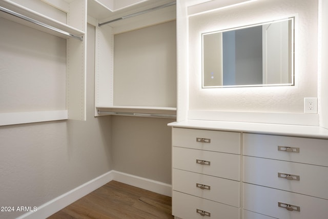 spacious closet featuring hardwood / wood-style floors