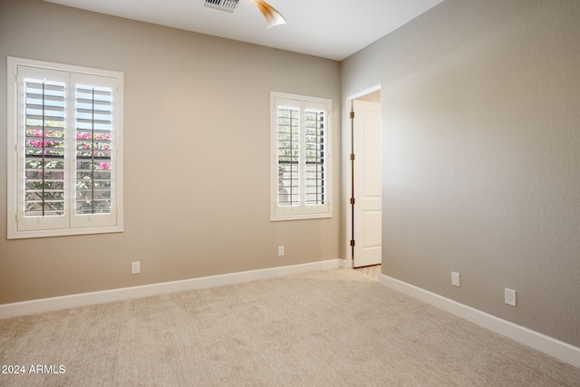 empty room featuring light colored carpet