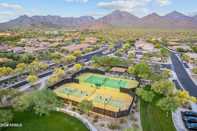 birds eye view of property with a mountain view