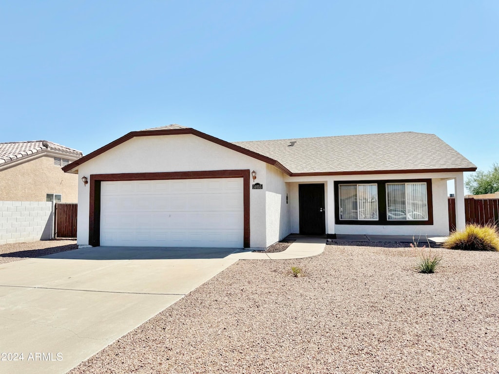 ranch-style home with a garage