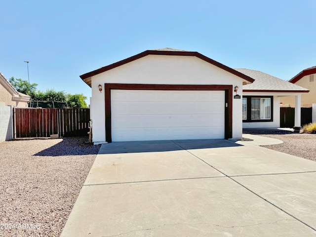 ranch-style house featuring a garage