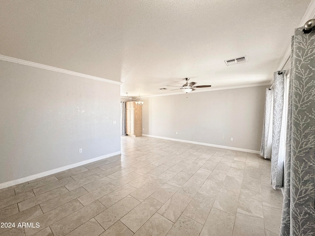 spare room with crown molding, a textured ceiling, and ceiling fan