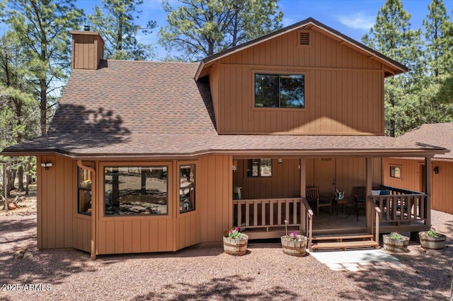 4170 Apache Dr, Happy Jack, AZ 86024 - chalet / cabin with a shingled roof and a chimney