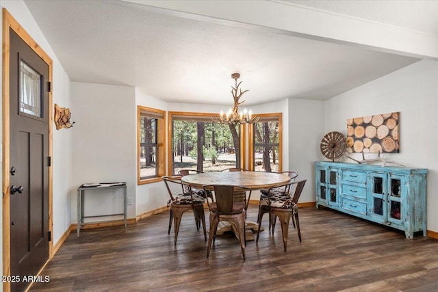 4170 Apache Dr, Happy Jack, AZ 86024 - dining area with a chandelier, baseboards, and dark wood-style floors
