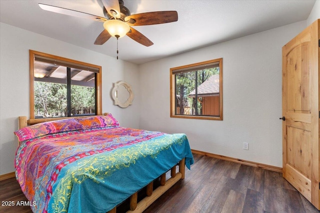 4170 Apache Dr, Happy Jack, AZ 86024 - bedroom with multiple windows, wood finished floors, and baseboards