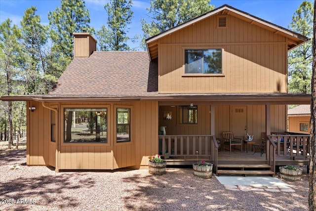 4170 Apache Dr, Happy Jack, AZ 86024 - chalet / cabin with a chimney and a shingled roof