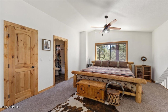 4170 Apache Dr, Happy Jack, AZ 86024 - carpeted bedroom featuring vaulted ceiling, ensuite bath, and a ceiling fan