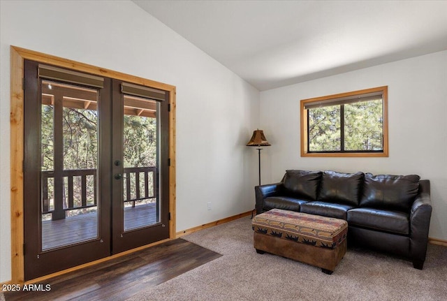4170 Apache Dr, Happy Jack, AZ 86024 - carpeted living room featuring french doors, vaulted ceiling, healthy amount of natural light, and baseboards