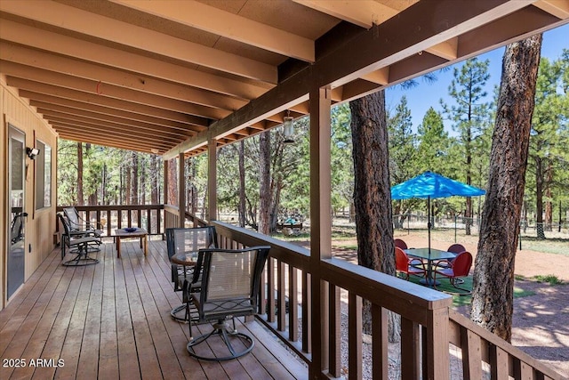 4170 Apache Dr, Happy Jack, AZ 86024 - deck featuring outdoor dining space and view of scattered trees