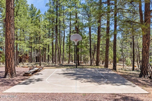 4170 Apache Dr, Happy Jack, AZ 86024 - view of sport court featuring community basketball court and a forest view