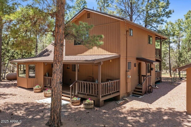 4170 Apache Dr, Happy Jack, AZ 86024 - view of front facade featuring roof with shingles and a porch