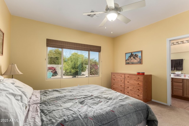 carpeted bedroom featuring ceiling fan and connected bathroom