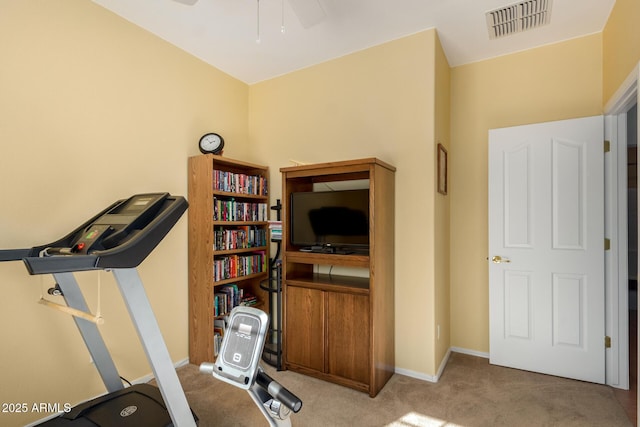 workout area featuring carpet floors and ceiling fan