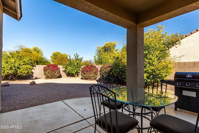 view of patio featuring a grill