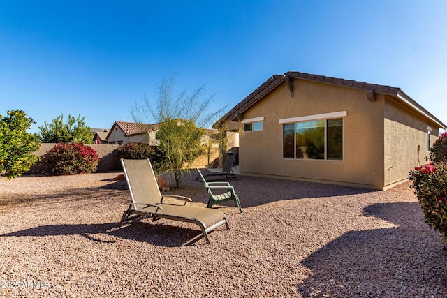 back of property with a patio