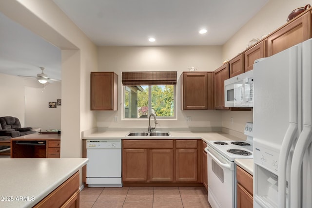 kitchen with ceiling fan, light tile patterned flooring, sink, and white appliances