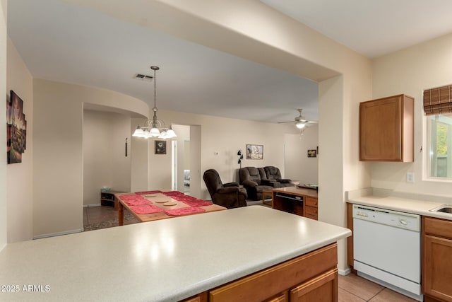 kitchen featuring ceiling fan, light tile patterned flooring, pendant lighting, and dishwasher