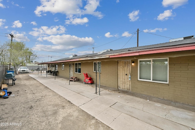 2237 E Taylor St, Phoenix, AZ 85006 - rear view of house featuring a patio area and brick siding