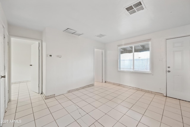 2237 E Taylor St, Phoenix, AZ 85006 - spare room featuring baseboards and light tile patterned floors