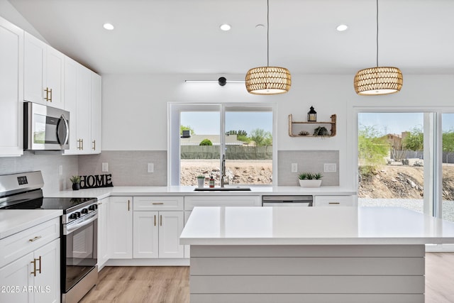 11509 W Langford Ct, Youngtown, AZ 85363 - kitchen featuring stainless steel appliances, a sink, healthy amount of natural light, light countertops, and recessed lighting