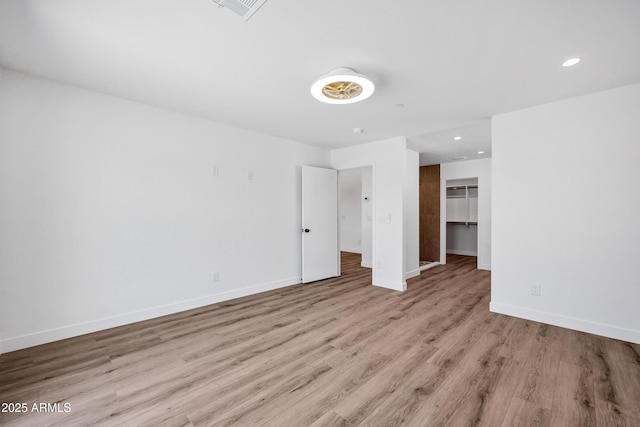 11509 W Langford Ct, Youngtown, AZ 85363 - unfurnished room featuring light wood-style flooring, baseboards, and recessed lighting