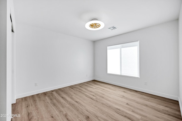 11509 W Langford Ct, Youngtown, AZ 85363 - unfurnished room with wood finished floors and baseboards