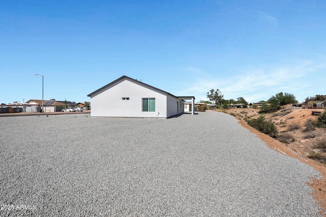 11509 W Langford Ct, Youngtown, AZ 85363 - view of property exterior featuring stucco siding