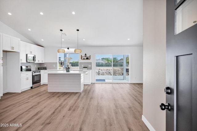 11509 W Langford Ct, Youngtown, AZ 85363 - kitchen featuring appliances with stainless steel finishes, light countertops, white cabinetry, a kitchen island, and recessed lighting