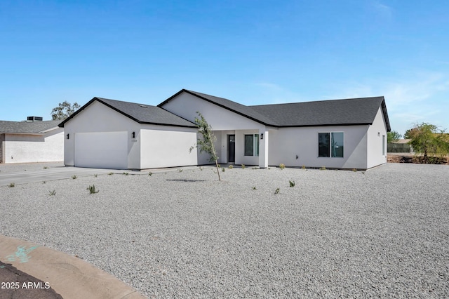 11509 W Langford Ct, Youngtown, AZ 85363 - view of front of property featuring an attached garage, stucco siding, and roof with shingles