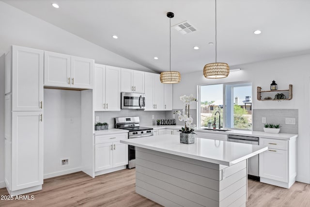 11509 W Langford Ct, Youngtown, AZ 85363 - kitchen featuring appliances with stainless steel finishes, a sink, backsplash, white cabinetry, and recessed lighting