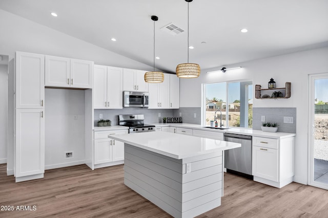 11509 W Langford Ct, Youngtown, AZ 85363 - kitchen with appliances with stainless steel finishes, a sink, backsplash, white cabinets, and recessed lighting