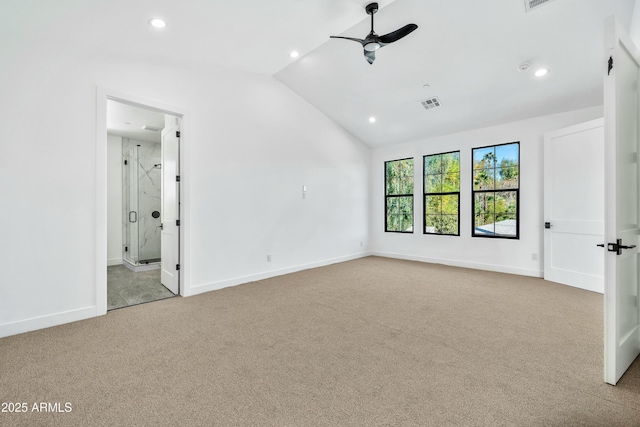 unfurnished bedroom featuring ceiling fan, lofted ceiling, light carpet, and ensuite bath