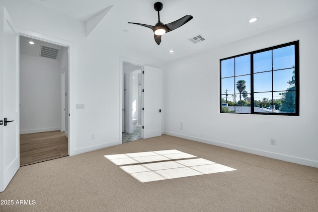 unfurnished bedroom featuring light colored carpet