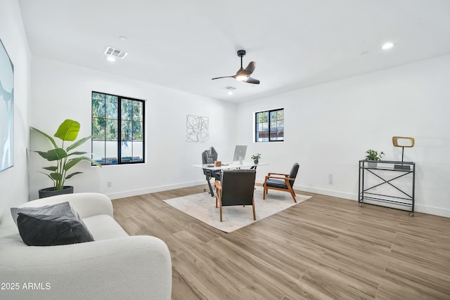 dining space featuring ceiling fan and light hardwood / wood-style flooring