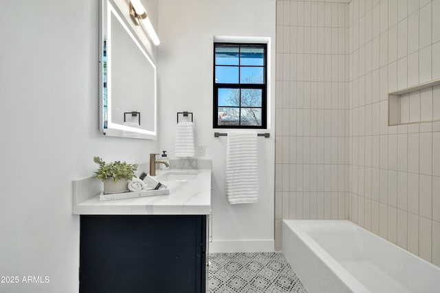 bathroom with vanity and tiled shower / bath