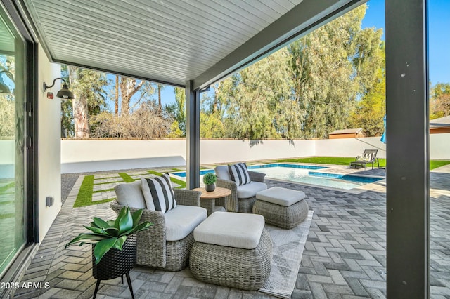 view of patio featuring a pool with hot tub