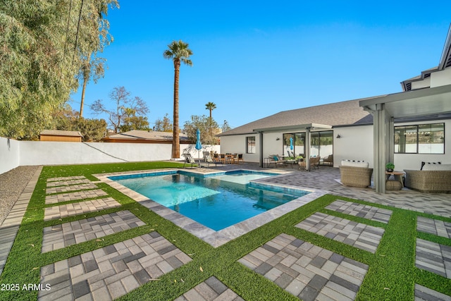 view of pool featuring a patio area