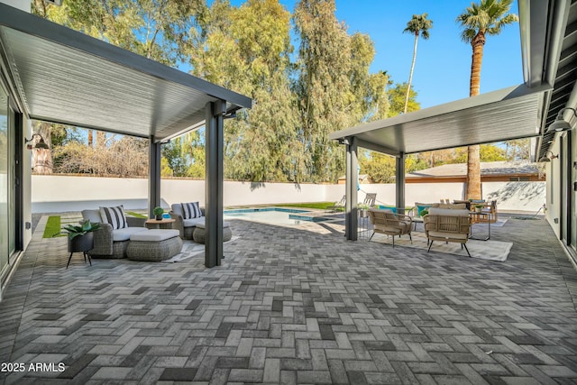 view of patio / terrace with a fenced in pool and an outdoor hangout area