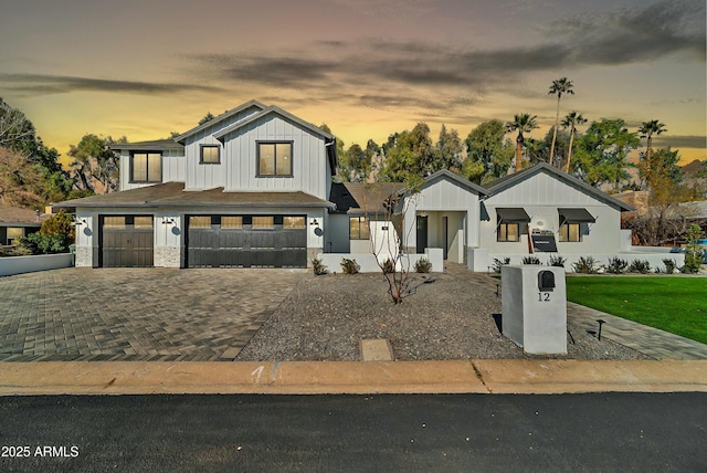 modern farmhouse style home with a garage