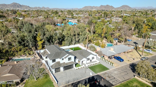 birds eye view of property featuring a mountain view