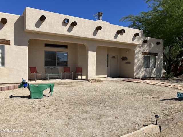 39281 Ave 61 Unit 1/2, Salome, AZ 85348 - back of property featuring a patio area and stucco siding