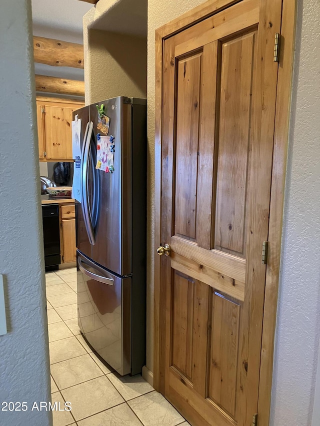 39281 Ave 61 Unit 1/2, Salome, AZ 85348 - kitchen featuring freestanding refrigerator, a textured wall, dishwasher, and light tile patterned flooring