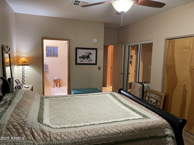 39281 Ave 61 Unit 1/2, Salome, AZ 85348 - bedroom with multiple closets, ensuite bathroom, and a ceiling fan