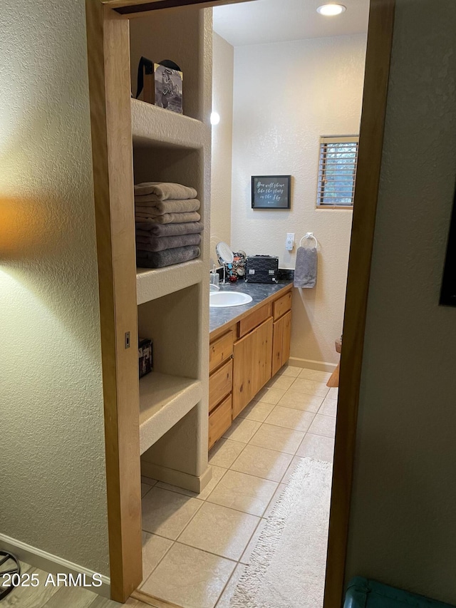 39281 Ave 61 Unit 1/2, Salome, AZ 85348 - bathroom with tile patterned floors, vanity, and baseboards